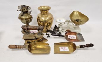 Assorted brassware including a Victorian brass iron with turned wooden handle, a brass oil lamp