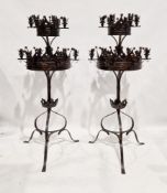 Pair of Victorian gothic-style wrought iron floor standing candelabra, each formed of two tiers with