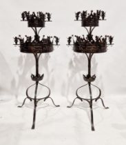 Pair of Victorian gothic-style wrought iron floor standing candelabra, each formed of two tiers with