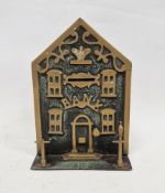 19th century brass and cast iron money box, in the form of a bank, the house-shaped front applied