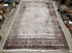 Large silk Turkish Kayseri carpet, cream ground, the central panel with stylised floral swirls