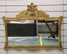 20th century rectangular wall mirror, gilt wood and gesso frame with scroll decorated borders,