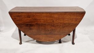 Georgian oak 'D' end drop flap dining table raised on tapered legs with pad feet, measuring approx