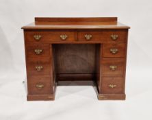 A nineteenth century mahogany kneehole desk, having two long drawers with a further three short