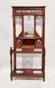 Early 20th century stained oak hall stand comprising various hooks, a rectangular bevelled edged