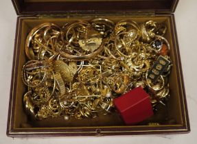 Quantity gold coloured metal jewellery, earrings and other items in a gilt leather jewel box.