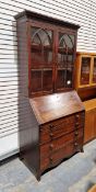 Victorian mahogany bureau bookcase, the top section having two glazed panels opening to reveal two