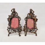 Pair of Late Victorian coppered spelter picture frames, each cast with a scantily draped figure of