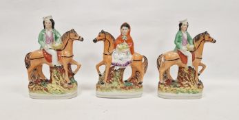 Three 19th century Staffordshire pottery equestrian figures including figure of a woman holding a