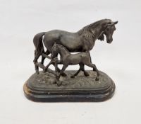 After Emile Loiseau (19th century), spelter model of a horse and foal before a fence, on shaped