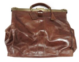 Pierre Cardin brown leather holdall, with gilt metal fittings and lockable clasp, green fabric