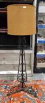 Early 20th century black painted metal telescopic standard lamp having scrolling decoration