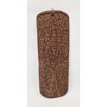 Carved Asmat wooden wall-hanging, circa 1970s, of shaped rectangular form carved with interlocking