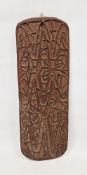Carved Asmat wooden wall-hanging, circa 1970s, of shaped rectangular form carved with interlocking