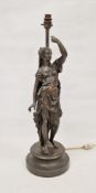 20th century bronzed metal figural table lamp, cast with a scantily-draped woman raising her left
