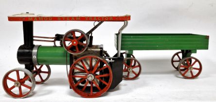 Mamod tinplate steam tractor with cream canopy and green trailer