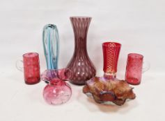 Collection of coloured glassware, including a pair of late Victorian cranberry glass mugs engraved