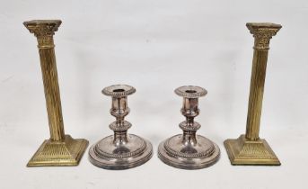 Pair of silver plated candlesticks with gadrooned borders on circular base, and another pair of