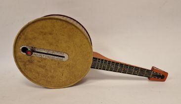 German tinplate musical banjo activated by sliding button, 44cm long