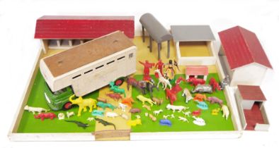 Quantity of plastic Britains farm animals, zoo animals, a Triang livestock lorry, vintage wooden