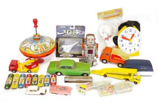Vintage spinning tinplate spinning top, a vehicle transporter, with various Hot Wheels and other