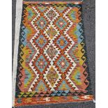 Chobi kilim, woven with geometric lozenges in blue, red, ochre on a cream ground within geometric