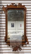 LOT WITHDRAWN Edwardian mahogany rectangular mirror, the fretwork frame with scroll pediment and