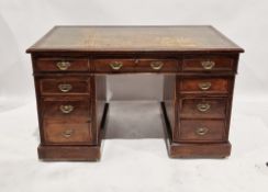Mahogany reproduction pedestal desk with leather inset top and an arrangement of nine short