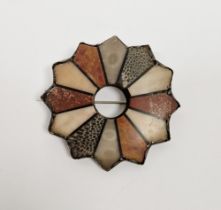 Silver-coloured metal and agate star-shaped brooch set with various panels of coloured agates