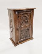 WITHDRAWN Antique oak side cabinet with single shelf enclosed by framed panel door, carved with