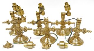 Assorted brass wall lights, each in the Victorian-style cast with scrolling branch and flowerheads
