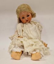 British composition headed doll with composition body and sleeping blue eyes, 61cm high