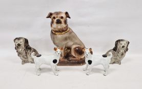 Pair of late 19th century Staffordshire pottery models of terriers with black and white patches,