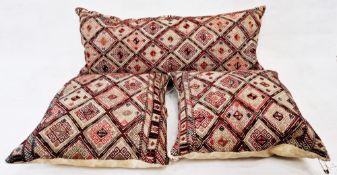 One pair of matching Moroccan cushions and a matching large bolster (3)  Condition Report Both