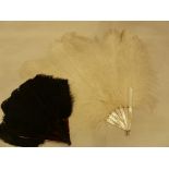 A mother of pearl ostrich feather fan described as a 'debutante's fan' with a black ostrich