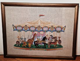 A 20th century woolwork tapestry depicting a carousel named 'Dentjel Menagerie Carousel', 42cm x
