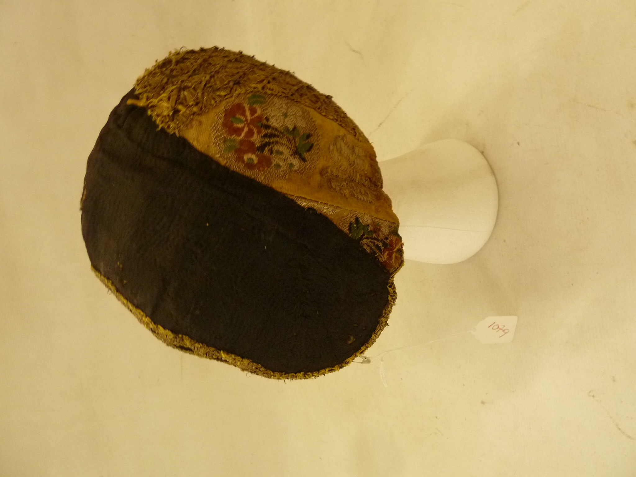 An 18th century and later lady's embroidered cap, the black border appears to possibly be a patch, - Image 2 of 4