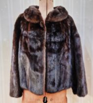 Dark brown mink jacket labelled 'Harrods', with a shawl collar, short length with bracelet