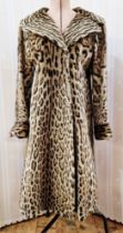 One 1960s ladies Ocelot fur coat with Cites certificate. Self-lined collar, 2 outer pockets, fastens