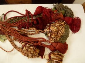 Passementerie seven pairs antique silk tie backs in reds and gold, with elaborate tassels