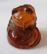 Japanese carved amber netsuke in the form of a fox, 2.5cm high, and a small collection of Asian