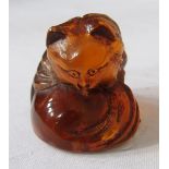 Japanese carved amber netsuke in the form of a fox, 2.5cm high, and a small collection of Asian