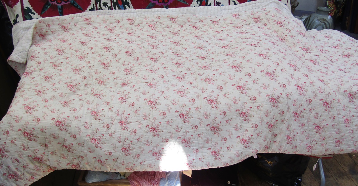 Mid 20th century reversible double quilt lined with wool, printed with pink flower sprays to one