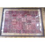 An antique handwoven panel, possibly Belouch, squares stitched together, 228 x 121cms double