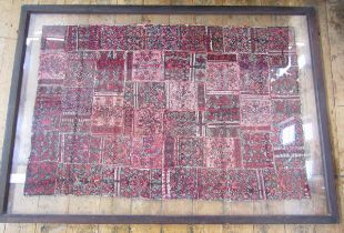 An antique handwoven panel, possibly Belouch, squares stitched together, 228 x 121cms double