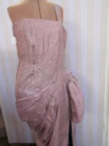 Elaborate pink lame evening dress, circa 1940s/50s, with a bold swag on one side and a train lined