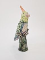 Amanda Popham (b.1954) studio pottery flower vase modelled as a parrot perched on a tree trunk,