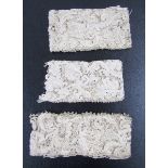 Two lengths of antique needlepoint lace, possibly Venetian, with raised work, floral scroll