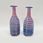 Pair of Mdina glass vases of hexagonal bottle form, mottled pink colourway with applied blue glass