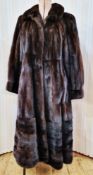 Natural mink dark brown fur coat, the embroidered lining with inner pocket, initialled 'LPD', the